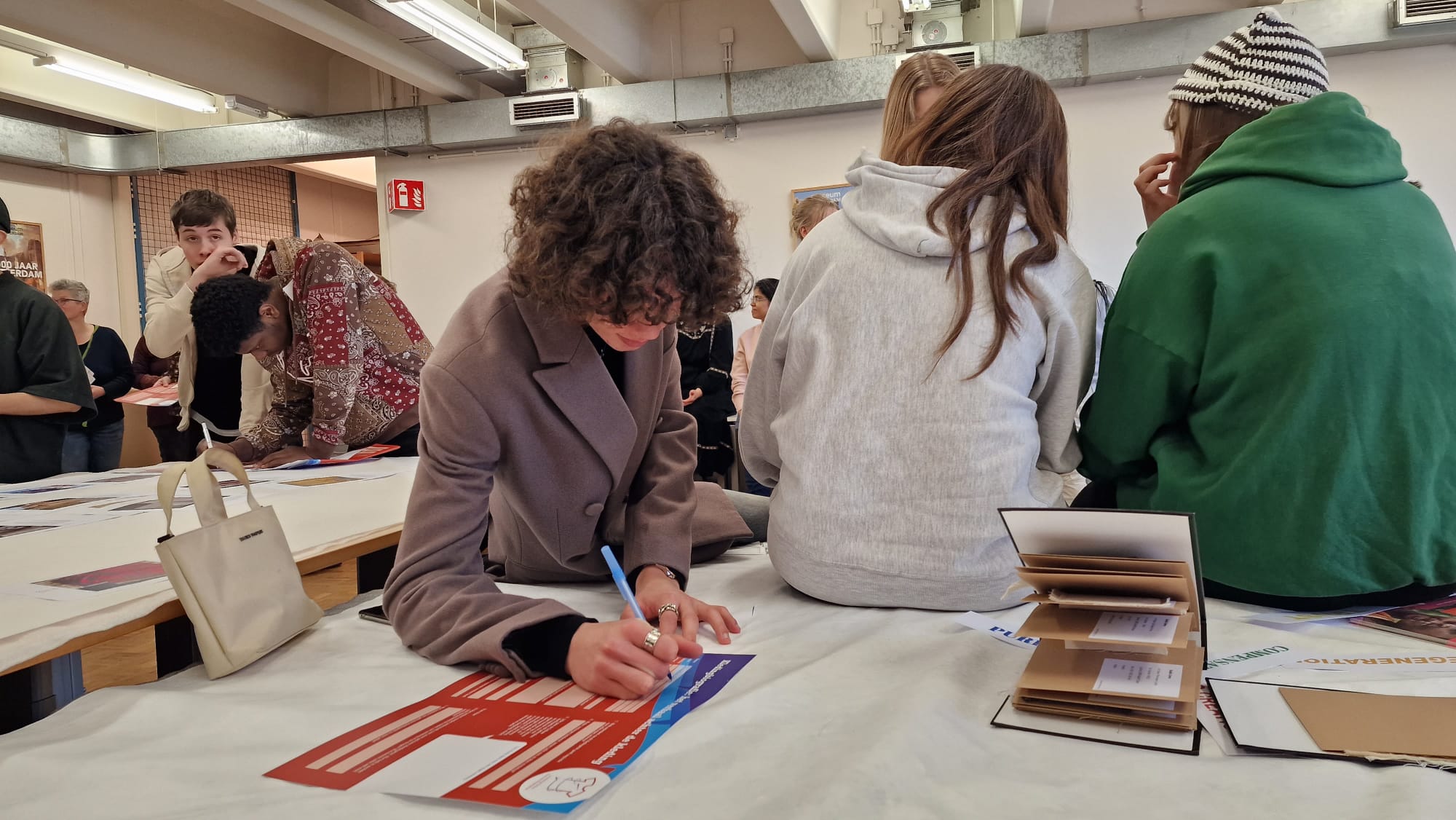 Students of Zadine College taking part in a project workshop conducted at the depot of Museum Rotterdam. Photo: Violetta Riedel.